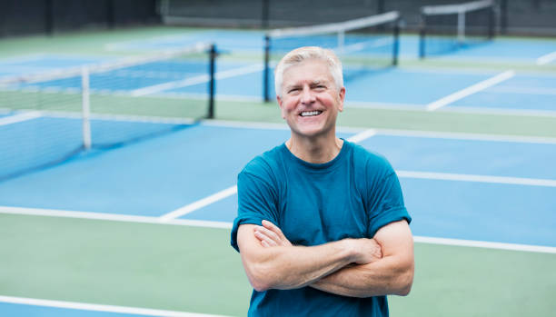 istock Senior man on pickleball court 1294217953