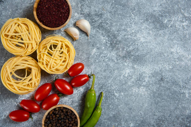 istock Raw nest pasta with spices and vegetables 1294218767
