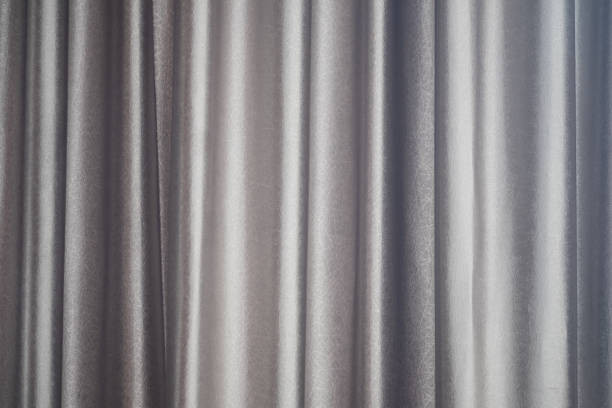 istock Brown curtain closed window in the morning. Curtain texture 1294219398