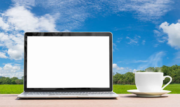 istock Laptop and cofree cup on table agent blue sky 1294221300