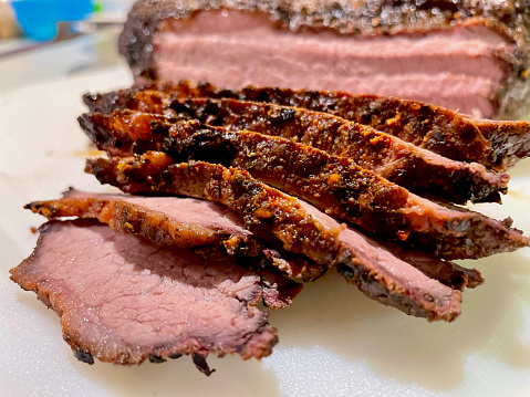Close-up of a smoked, beef brisket freshly sliced ready to serve.