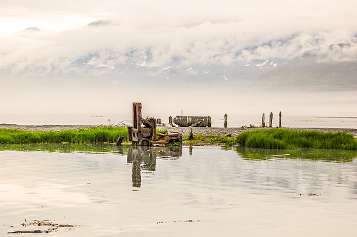 An abandoned forklift sits in the waters of Valdez Harbor. Long past its use, this forklift sits as a reminder of days gone by.