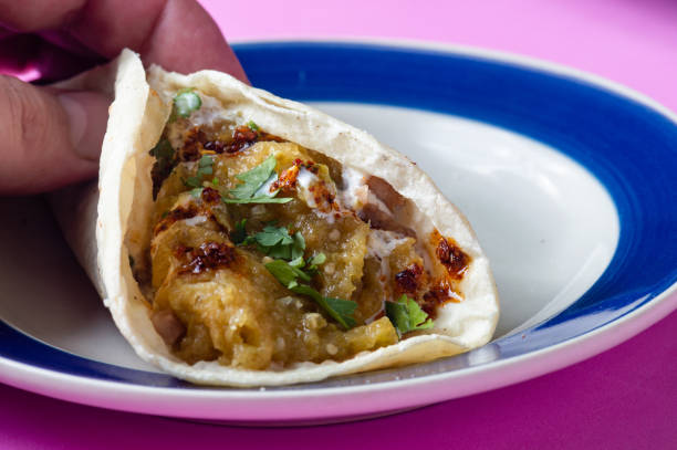 istock Pork rinds in green salsa with refried beans 1294226174