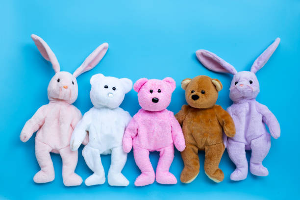 istock Toy rabbits and bears on blue background. 1294226998