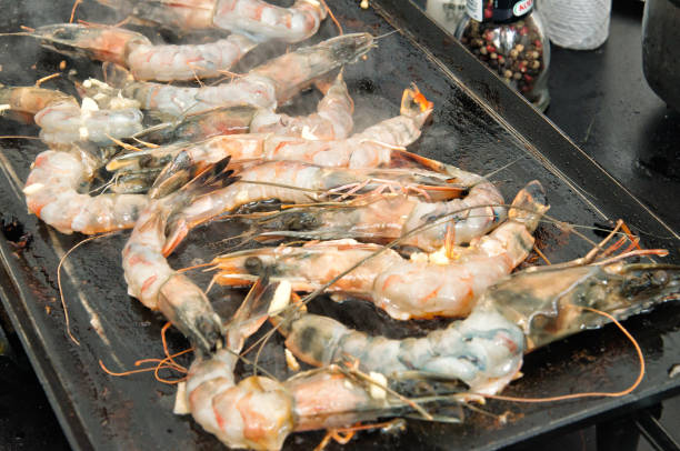 istock Barbecue season - fresh shrimp on the grill 1294228576