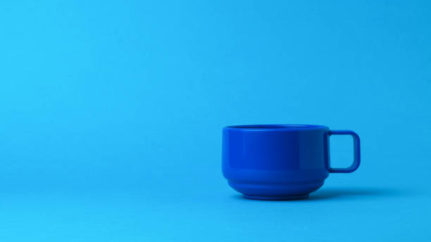 istock Stylish blue mug on a blue background. 1294231340