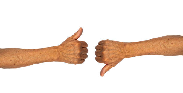 Thumb up and down senior hand gesture isolated on white background with clipping path