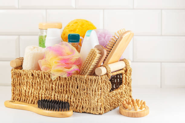 istock Basket with bathroom accessories - brushes, shampoo, soap, washers on a white background 1294235761