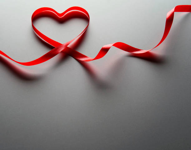 istock Heart Shaped Red Ribbon 1294237984