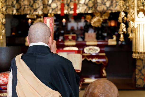 istock Japanese monk praying at a temple 1294239379