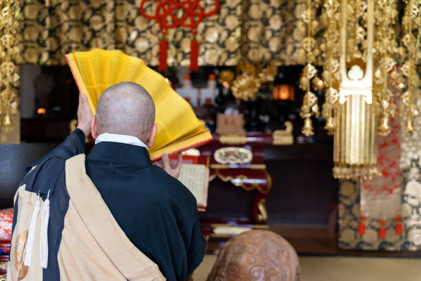 istock Japanese monk praying at a temple 1294239912