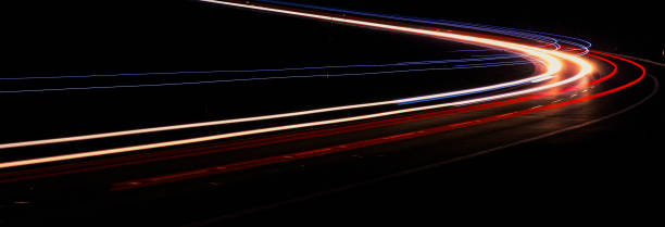 istock lights of moving cars at night. long exposure 1294242527