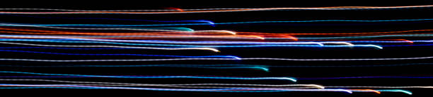 istock colored lines on a black background.textura 1294242801