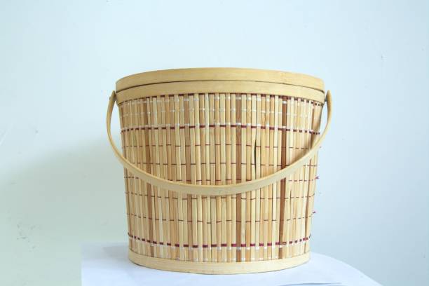 istock Handwoven bamboo basket with handle, traditional handicraft concept, container 1294243885