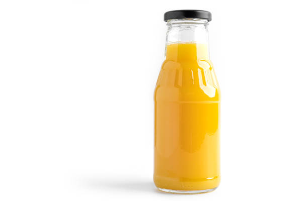 istock Orange juice in bottle on a white background 1294244925