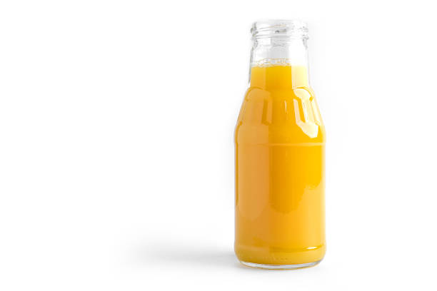 istock Orange juice in bottle on a white background 1294244948