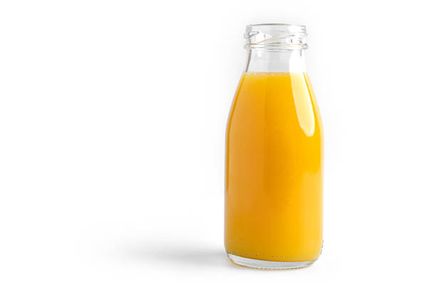 istock Orange juice in bottle on a white background 1294244988
