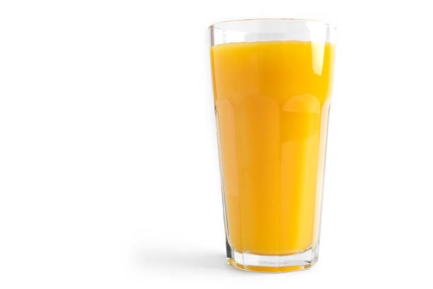 istock Orange juice in glass on a white background 1294245041