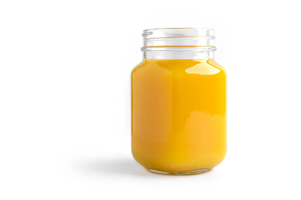 istock Orange juice in mason jar on a white background 1294245062