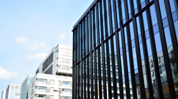 istock Fragment facade of a modern office building with glazing, perspective. 1294249622