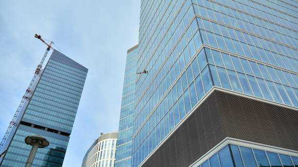 istock Fragment facade of a modern office building with glazing, perspective. 1294249785