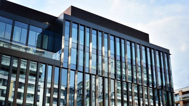 istock Fragment facade of a modern office building with glazing, perspective. 1294249790