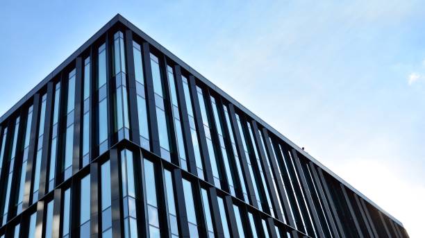 istock Fragment facade of a modern office building with glazing, perspective. 1294249798