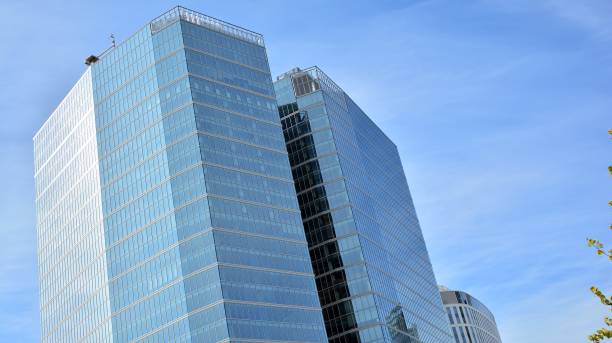 istock Fragment facade of a modern office building with glazing, perspective. 1294249807