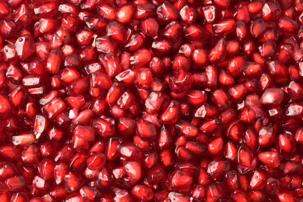 istock Full frame of pomegranate seeds, top view 1294251508