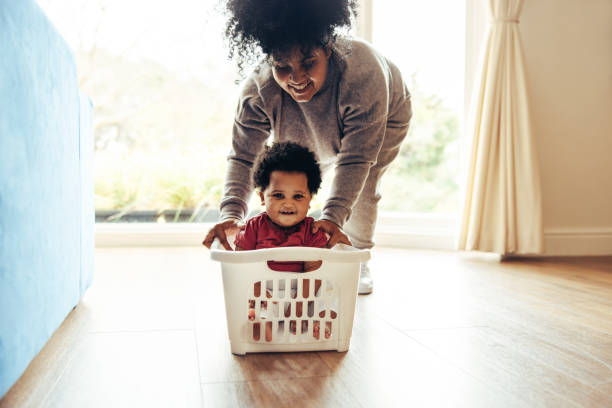istock Mother and baby playing at home 1294252353