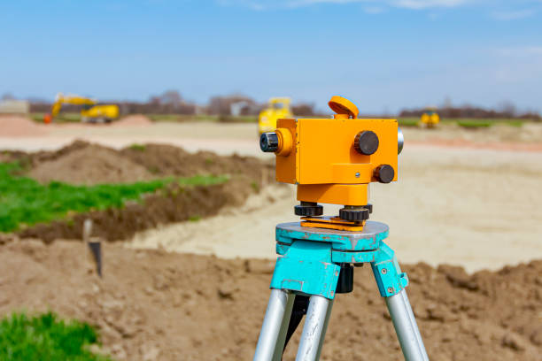 istock Geodesist device on tripod on a building site 1294252643
