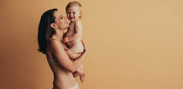 istock Smiling mom and baby 1294252654