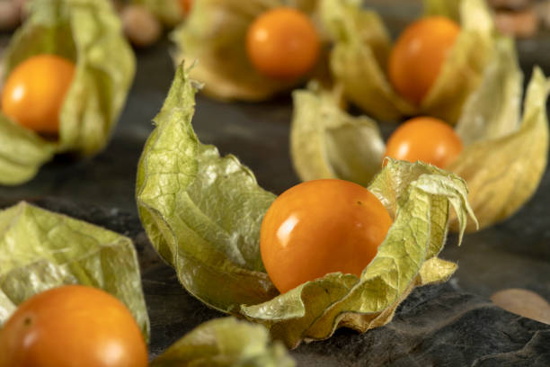 istock Cape gooseberry - physalis on a black stone background 1294253344