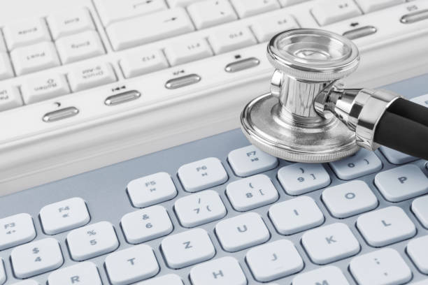 istock Online medicine with stethoscope and PC keyboard 1294255826