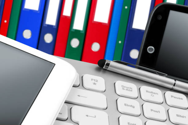istock Working station with folders, tablet, mobile and PC Keyboard 1294255932