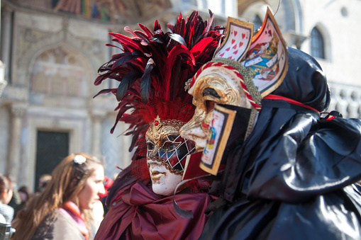 Close up of black and white carnival mask at City of Venice on a cloudy summer day. Photo taken August 6th, 2023, Venice, Italy.