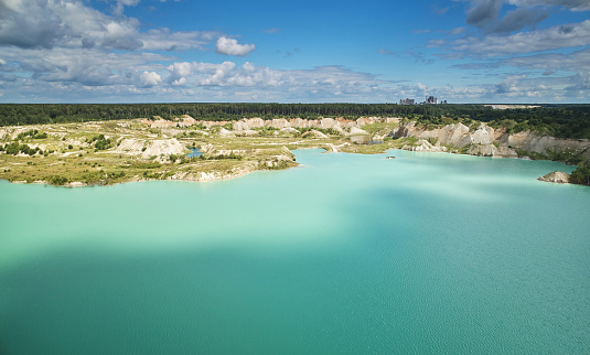 Geological eco theme. Green lake in quarry aerial above top view