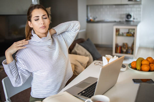 istock Young woman working from home and feeling stressed 1294259059