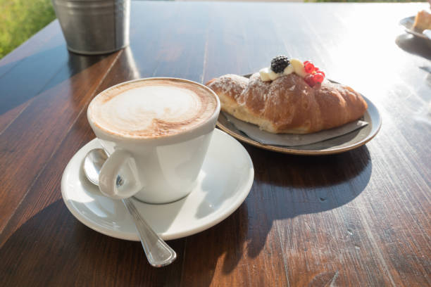 istock Breakfast at the beach with pasta and capuccino 1294260002