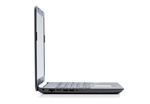 Modern laptop with empty screen isolated on white background. Side view