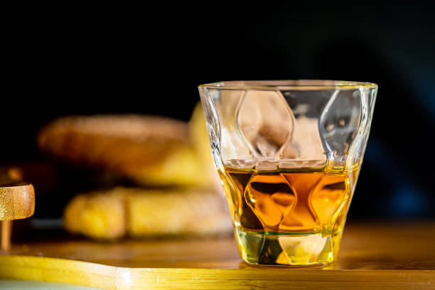 istock Whisky in whiskey glass on wooden table 1294262304