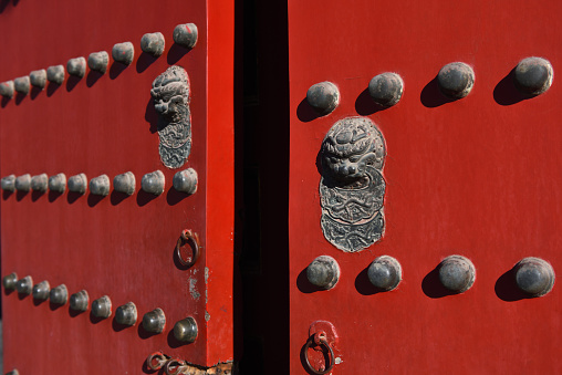 red door with doormail in the fobidden city