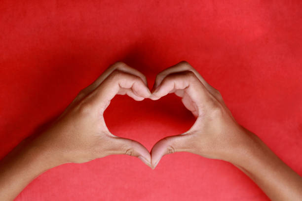 istock Both hands are making a heart shape.  Represents love on valentines day 1294267251