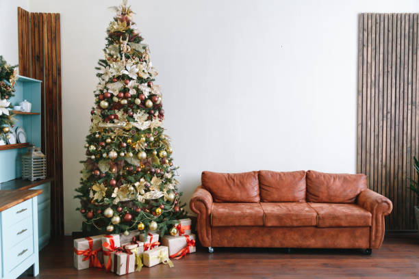 istock Christmas tree with leather sofa in a white room 1294267329