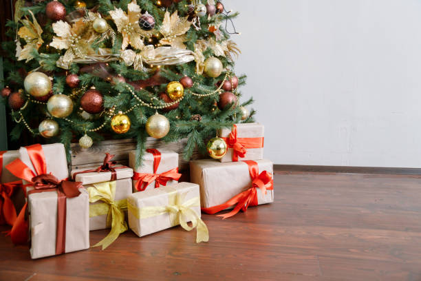 istock Christmas tree with gifts on red background. 1294267333