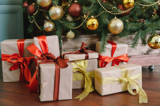istock Christmas tree with gifts on red background. 1294267335