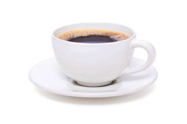 istock Black coffee in a white cup on plate top view isolated on white background 1294268112