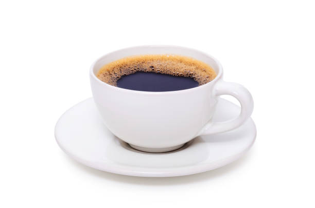 istock Black coffee in a white cup on plate top view isolated on white background 1294268128