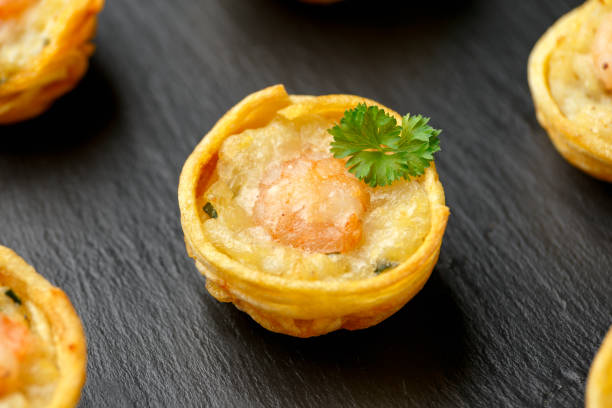istock Mini party Fish Pie Food with prawn on rustic stone background 1294269606
