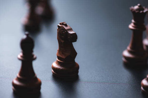 istock Chess pieces board game in business success leadership concept 1294270180